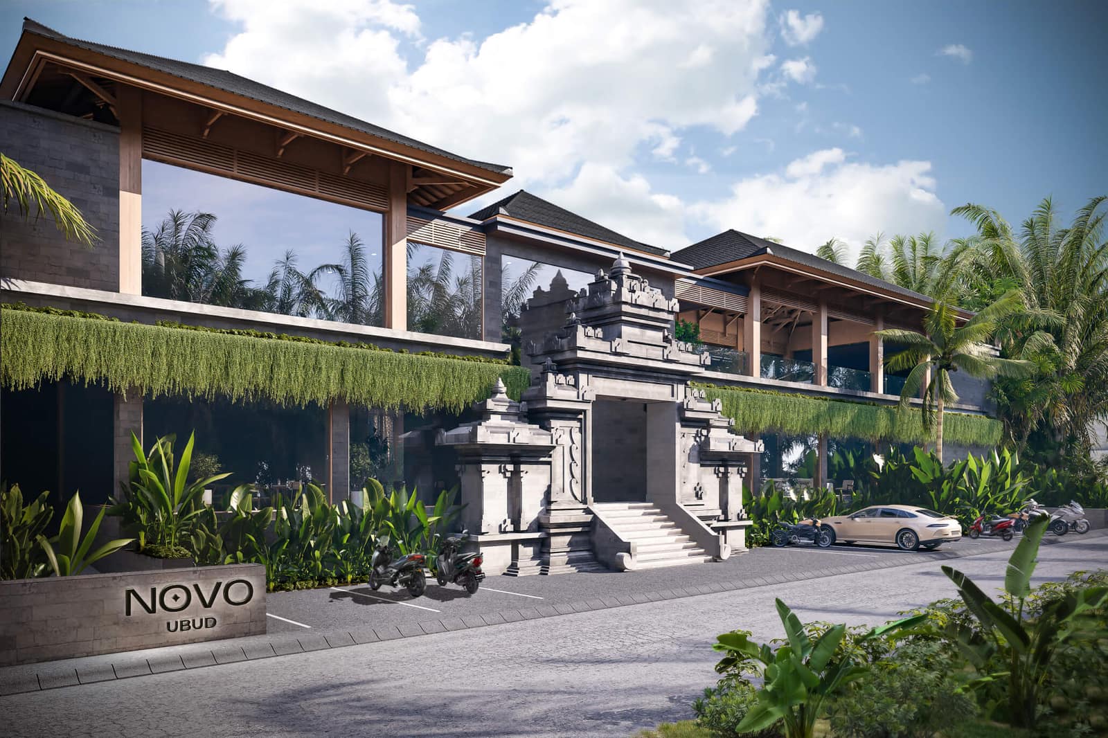 Render of the NOVO Ubud facade showing the green-roof terraces, a carved Balinese gateway and the NOVO Ubud signage at the entrance